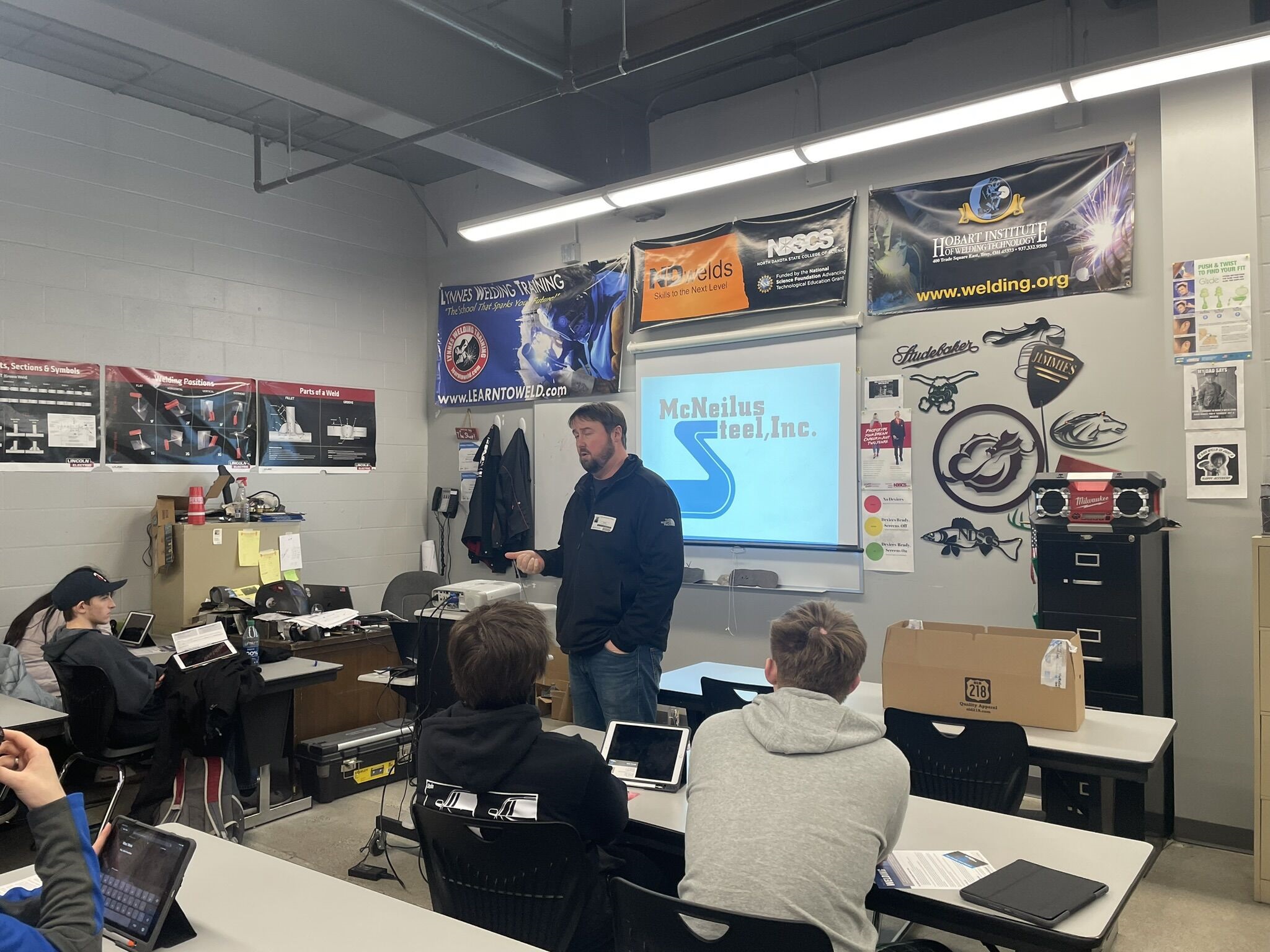 McNeilus Steel employee speaking to a classroom of students at West Fargo High School